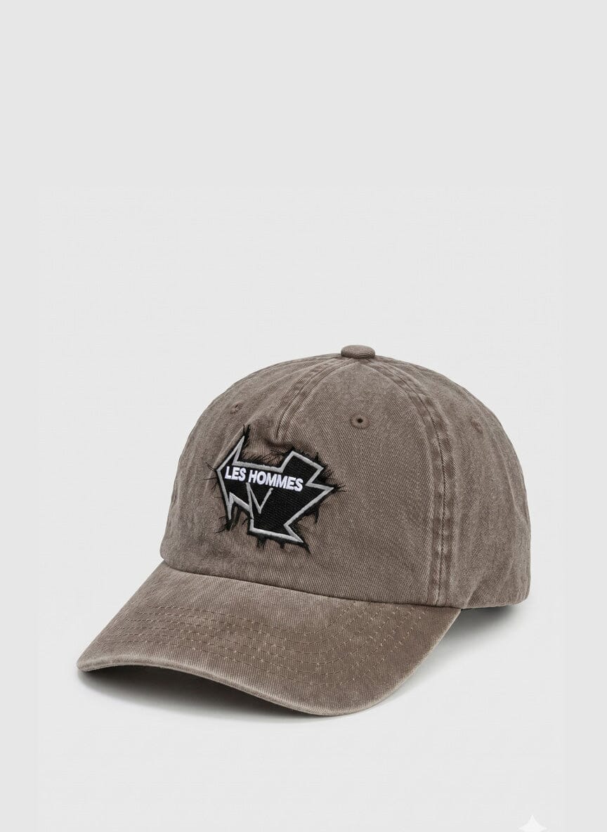 brown distressed cap with a black and white Les Hommes patch on the front