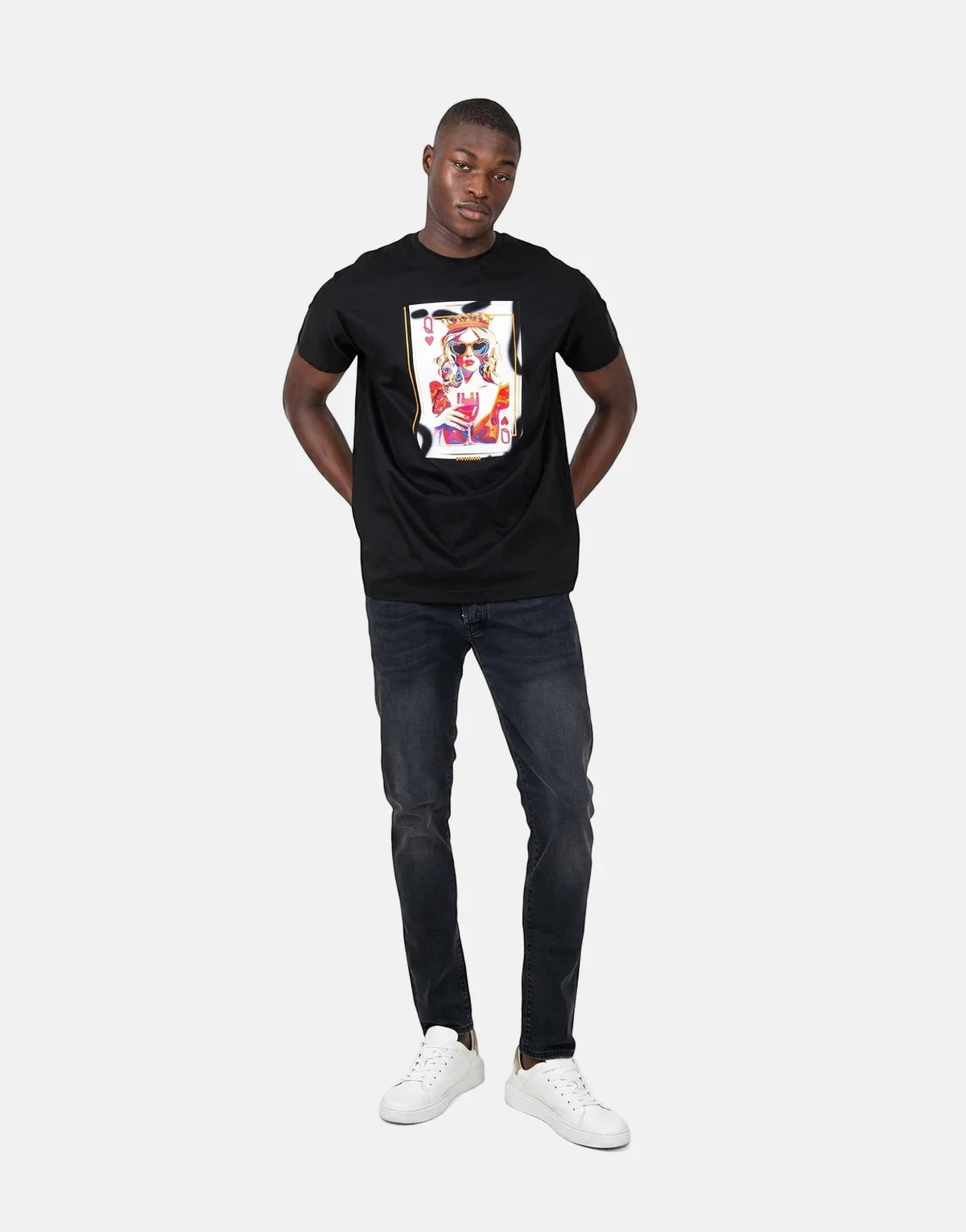 Black Les Hommes Queen Of Hearts t-shirt worn by a male model, featuring a vibrant playing card graphic on the chest.